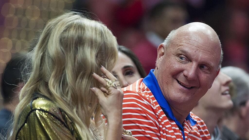 Clippers owner Steve Ballmer talks with Fergie before she performs during the intermission of the Clippers' 114-89 victory over the Lakers Wednesday night Jan. 7, 2015 in Los Angeles. (AP Photo/The Orange County Register, Kevin Sullivan)