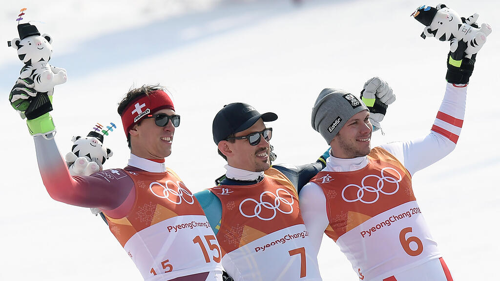 Ramon Zenhäusern (SUI/2.Platz), Andre Myhrer (SWE/1.Platz) und /3.Platz) am Donnerstag im Rahmen des Slalom der Herren -Siegerpräsentation im Alpine Centre in Yongpyong.